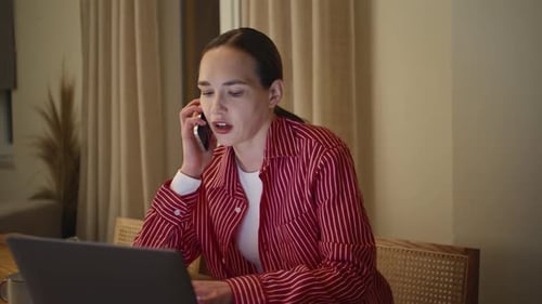 Late Businesswoman Talking Cellphone in Home Office Closeup Woman Making Order