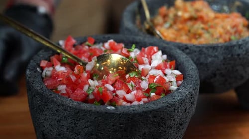 Mixing Fresh Salsa in Stone Bowls