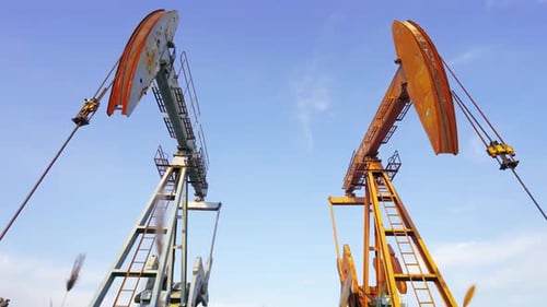 Industrial petroleum crude drilling rigs derrick, oil pump jack equipment work oilfield, continuous