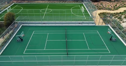 Aerial View of Tennis Courts in the Mountain Landscape