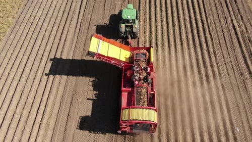 Aerial View of Potato Harvesting Tractor on Farm
