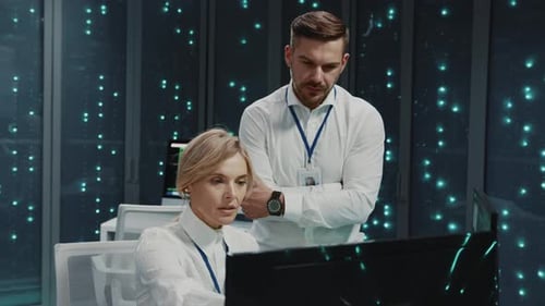 Two IT Professionals Work in Data Center