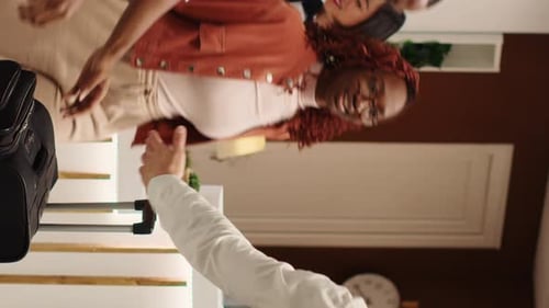 Woman Checking into Hotel at Reception Counter