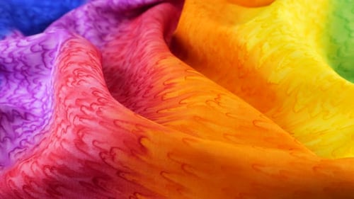 Vibrant Multicolored Fabric with Scale-like Pattern Close Up