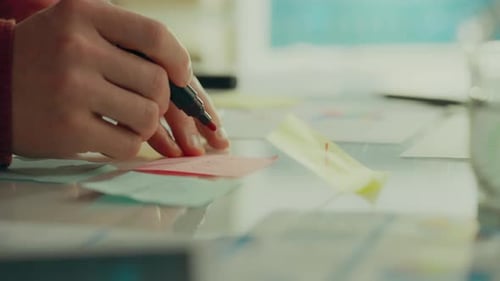 Writing Ideas on Sticky Note in Office