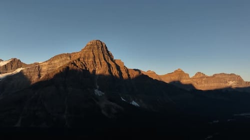 Mountains and rocks during sunset. High rocky mountains. Banff National Park, Alberta, Canada.