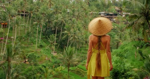 Woman Enjoying Tropical View with Palm Trees