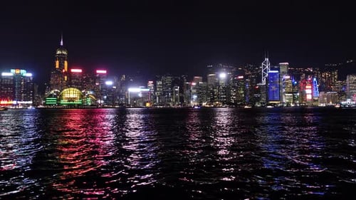 Spectacular Nighttime Skyline of Hong Kong with Illuminated Skyscrapers and Reflections