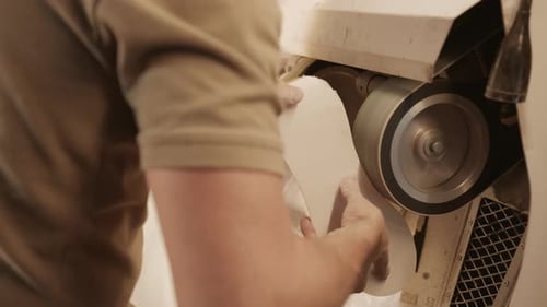 Wood Being Smoothed by Machine at the Factory