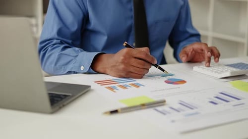 Close up of hands are working and brainstorming on paperworks.