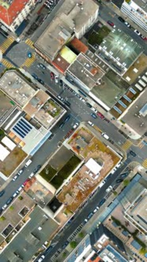 Aerial, drone view of the streets and buildings of Geneva, Switzerland. Vertical