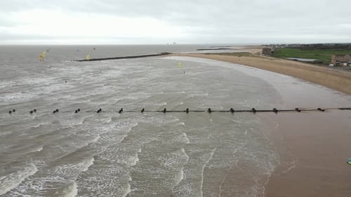 Kite surfers at Clacton on Sea very windy day drone footage