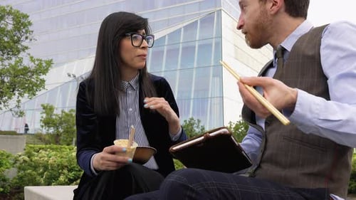 Business people eating a meal outside the office