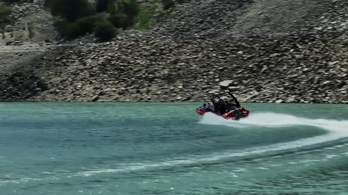 Jet Boat Speeding on Tropical Mountain Lake