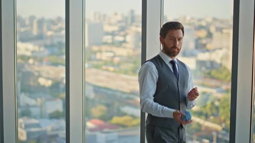 Stressed Leader Thinking Decision Tossing Ball at Cityscape Pensive Bearded Man
