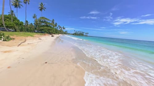 Paradise beach in Dominican Republic, FPV drone flying above it
