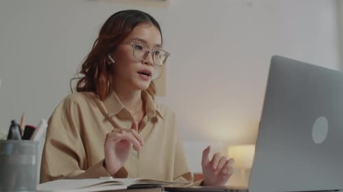 Woman on Video Call Working from Home Office