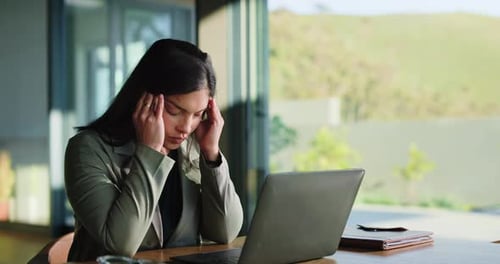 Woman, stress and business at office with laptop, deadlines and headaches for company