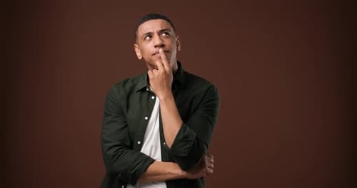 Pensive Man Thinking with Hand on Chin