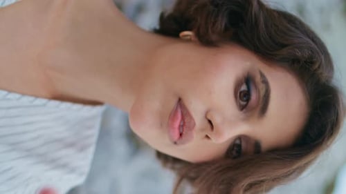 Elegant Woman Posing with Stylish Makeup and Hair