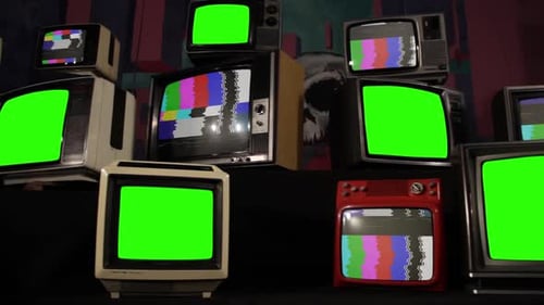 Pile of Old TVs with Color Bars and Green Screens.