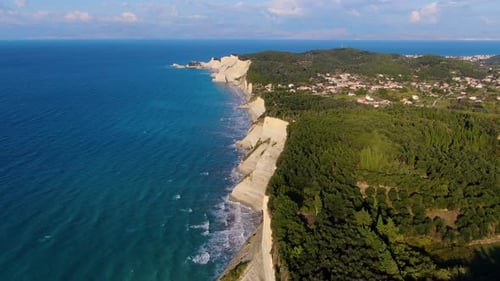 Stunning aerial drone view of the massive white sedimentary cliffs at Loggas Beach Peroulades, Corfu