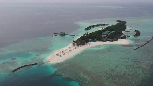 Aerial view of beautiful Maldives island. Tropical beach white sand bar, blue Indian Ocean palm tree