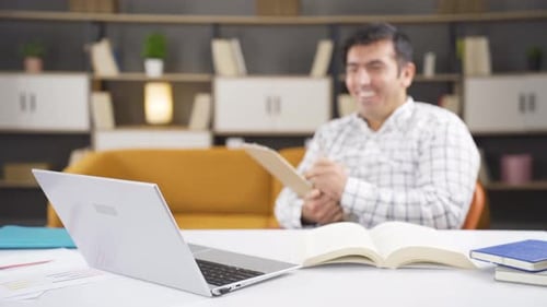 Delighted home office worker applauding.