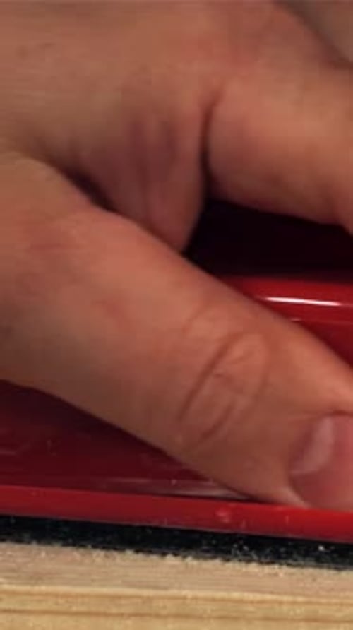 A Carpenter Sands a Wooden Plank Filmed on a Highspeed Camera at 1000 Fps