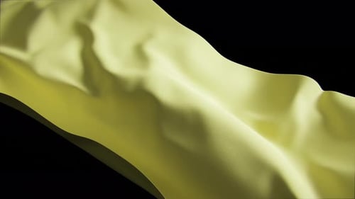 Yellow Cloth Waving Gently Against Black Background