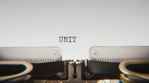 Old mechanical typewriter typing United Nations in a close-up view.