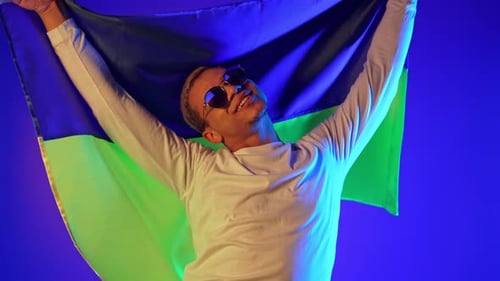 Person Holding Flag, Smiling