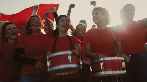 Crowd football fans exulting while watching soccer game at stadium - Sport entertainment concept