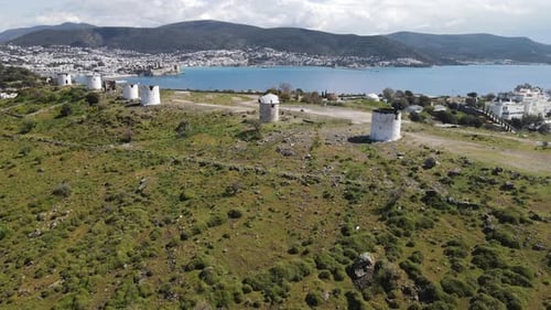 Picturesque Windmills on Hillside Overlooking Beautiful Coastline