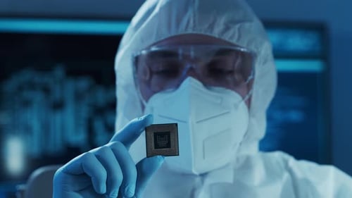 Microelectronics Engineer Works in a Modern Scientific Laboratory on Computing Systems Electronic