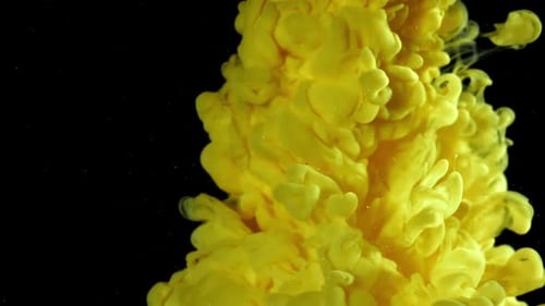 Bright Yellow Ink Cloud Abstract on Black Background