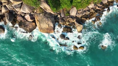 Waves crushing on rocks on the beach.