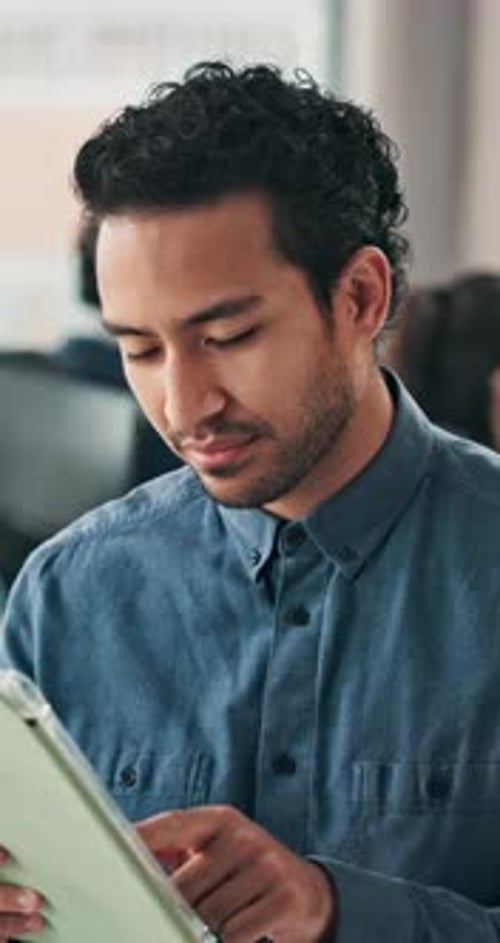 Creative, man and browsing in office with tablet, planning idea or project for social media