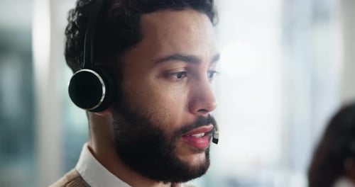 Man, closeup or talking in call center with headphones for advice, customer support