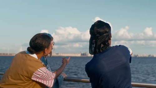 Friends Discussing View Form River Bank