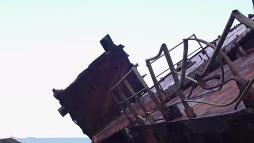 Rusty Damaged Viewing Deck Of Shipwreck By The Shoreline In England - close up shot