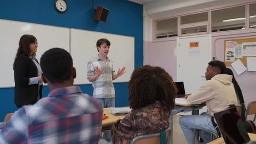 Teen Student Giving Presentation in Classroom