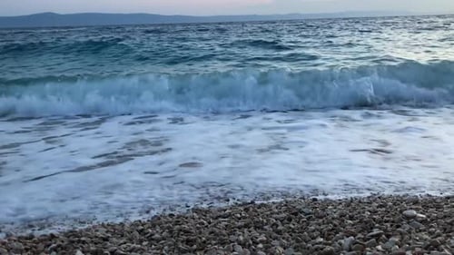 Sea Waves During a Storm Run on the Beach of the Sea Coast on a Sunny Day Sea Waves with White