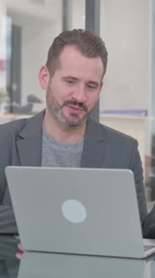 Man Talking During a Video Call at Work