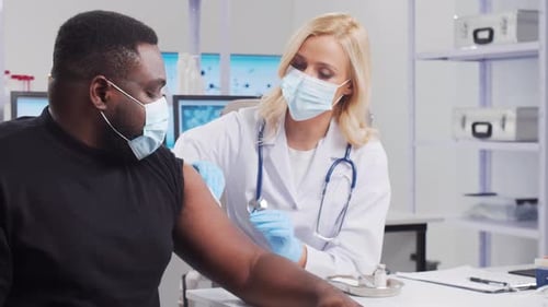 Doctor Giving Patient an Injection in Medical Office