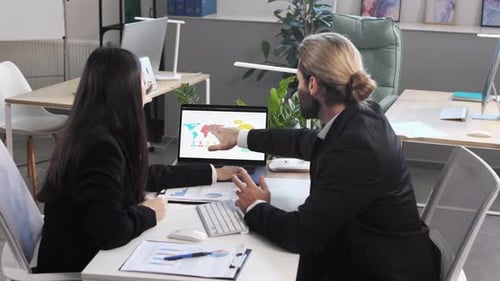 Business Colleagues Discussing Global Strategy in Modern Office