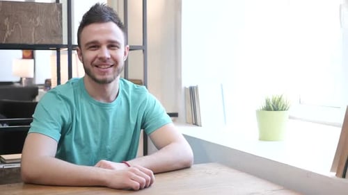 Young Adult Man Speaks Directly to the Camera
