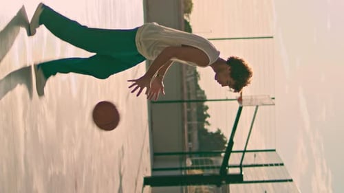 Involved Teenager Bounce Ball at Stadium Basketball Player Making Basket Throw