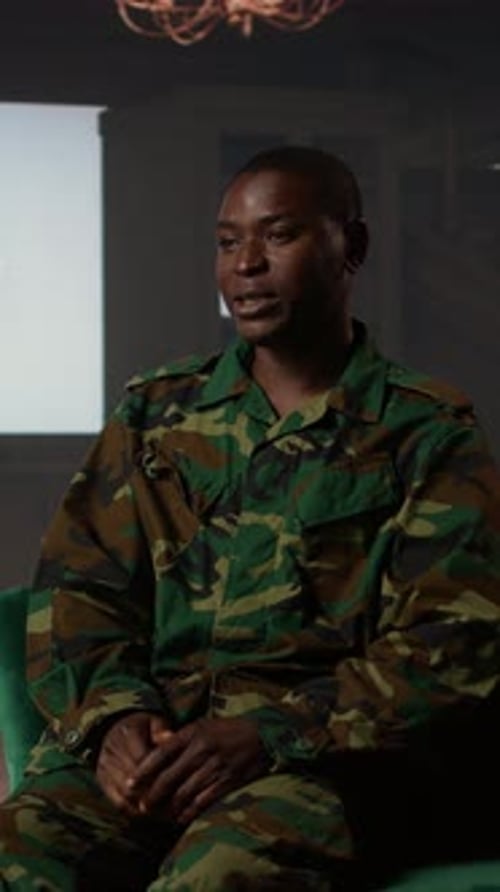 Man in Military Uniform Talking and Gesturing