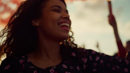 Young Adults Celebrate with Smoke Flares on Rooftop